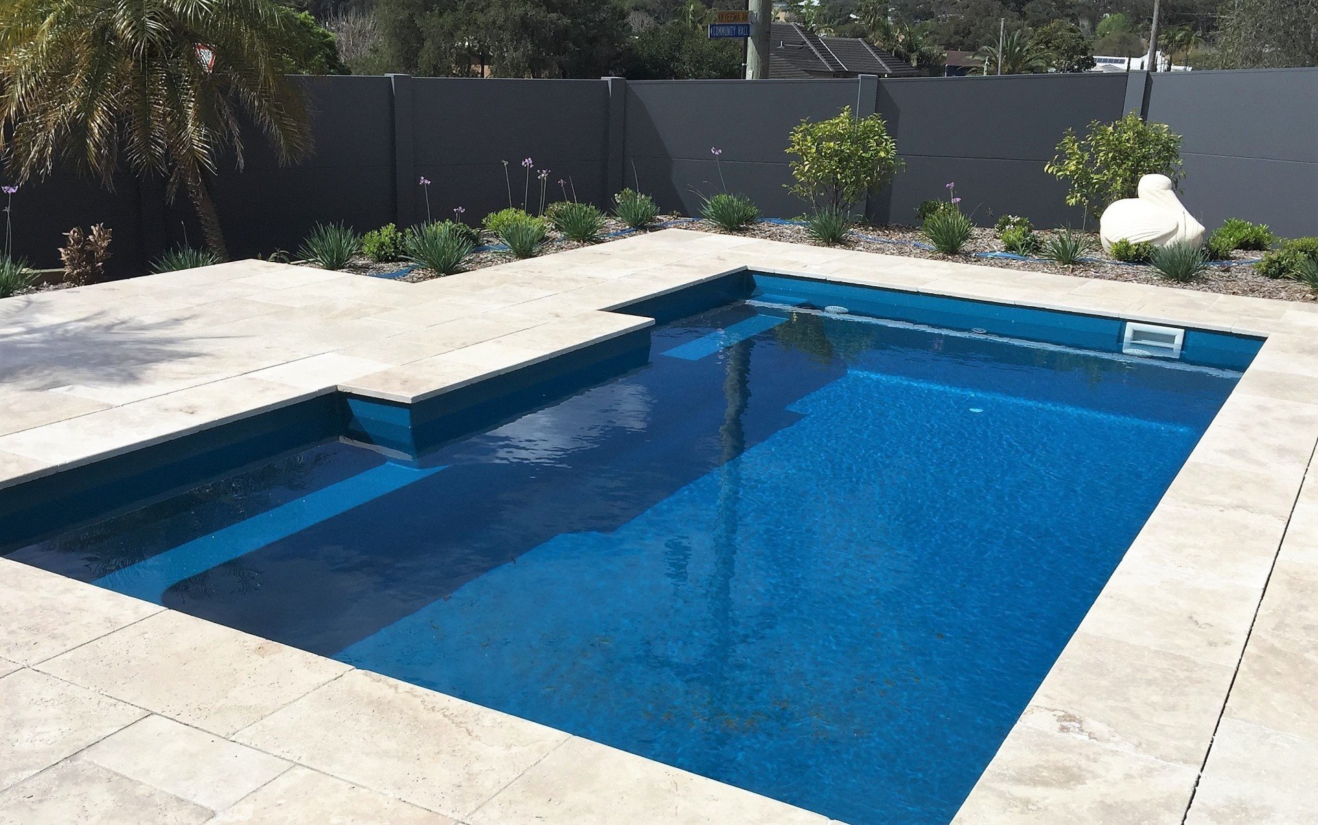Fibreglass Pool Tranquility range lap pool in teal spice and landscaping installation