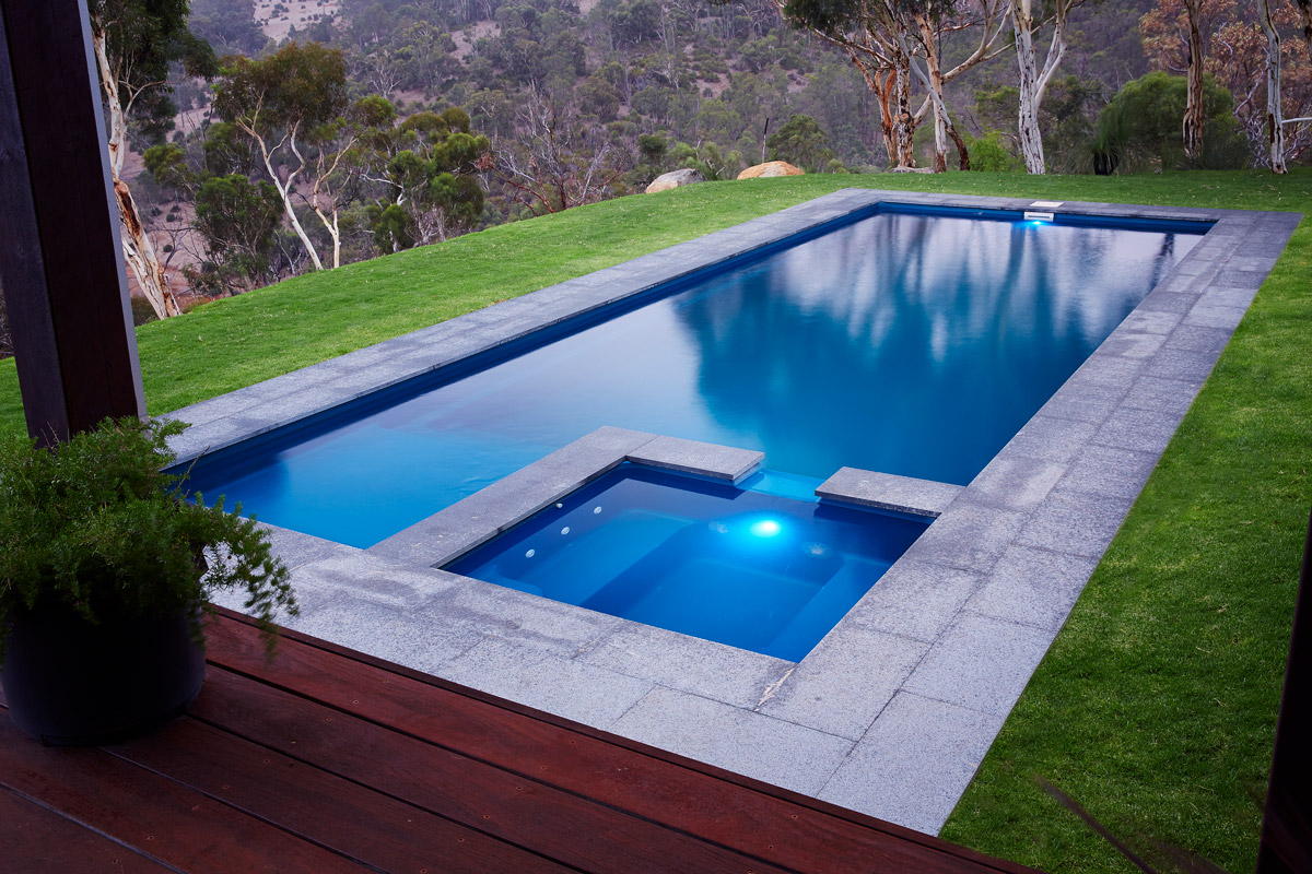 spa and fibreglass pool with grass area